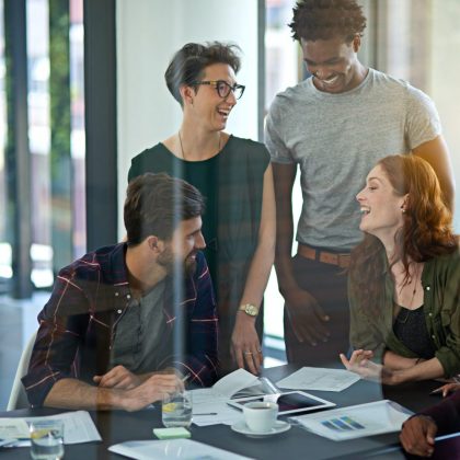 cropped-shot-of-a-group-of-creatives-working-together-on-a-digital-tablet-in-a-modern-office-e1681670976268.jpg